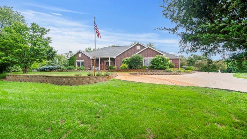 9962 Freeport Road Rock Falls, IL 61071 - Photo 1 of 1 a front view of a house with a yard