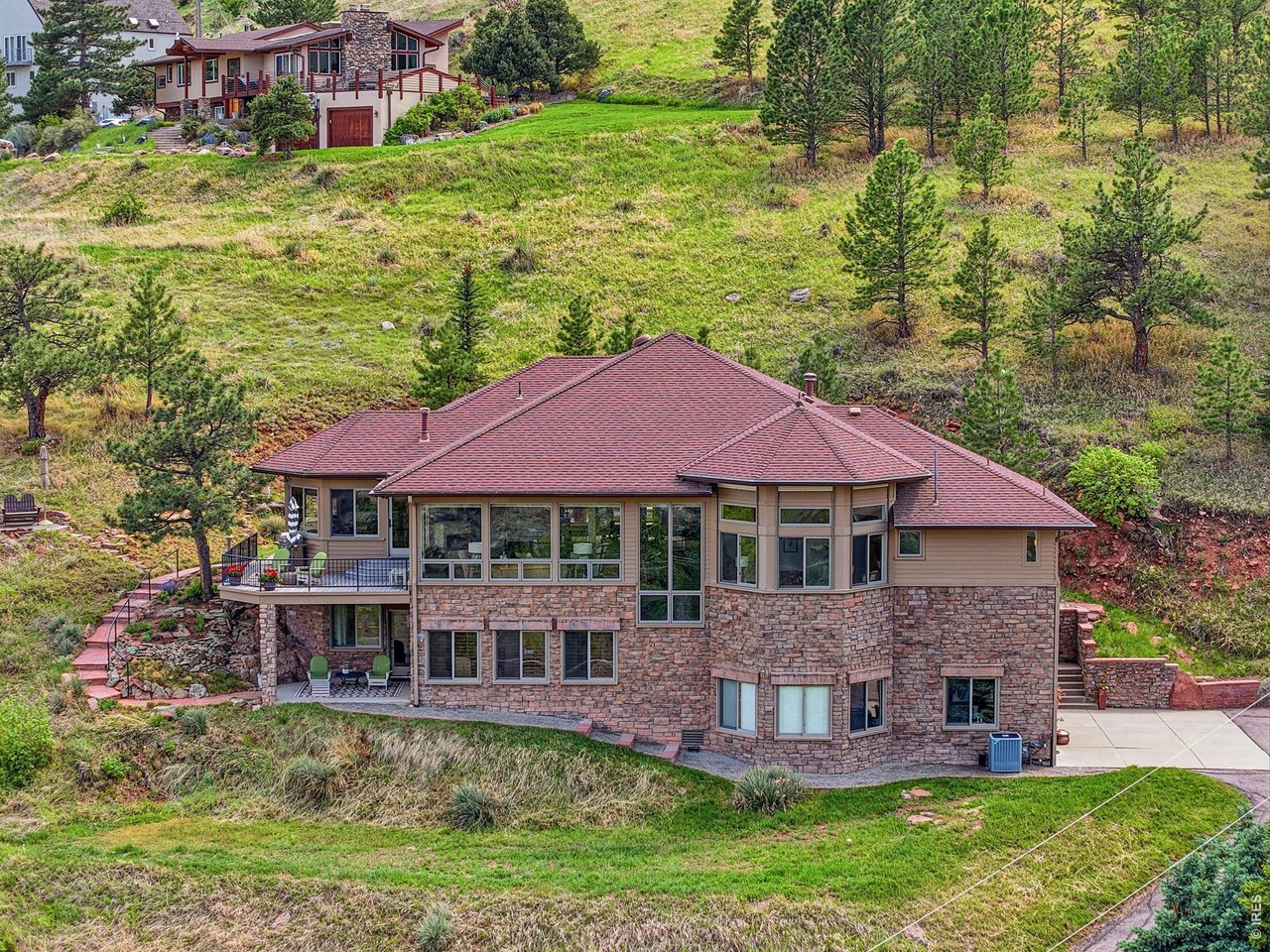 86 South Cedar Brook Road Boulder, CO 80304 - Photo 37 of 40 a view of a house with a yard and sitting area
