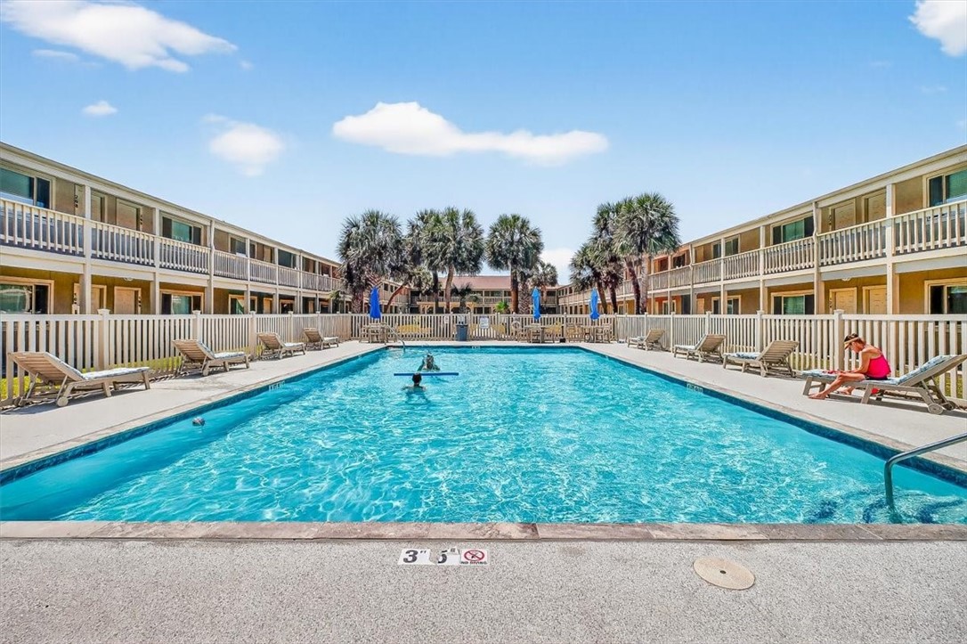 622 Beach Access Road, Unit 216 Port Aransas, TX 78373 - Photo 1 of 32 a view of yard with swimming pool and sitting area