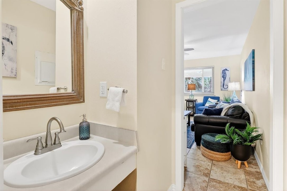 622 Beach Access Road, Unit 216 Port Aransas, TX 78373 - Photo 17 of 32 a bathroom with a sink mirror and window