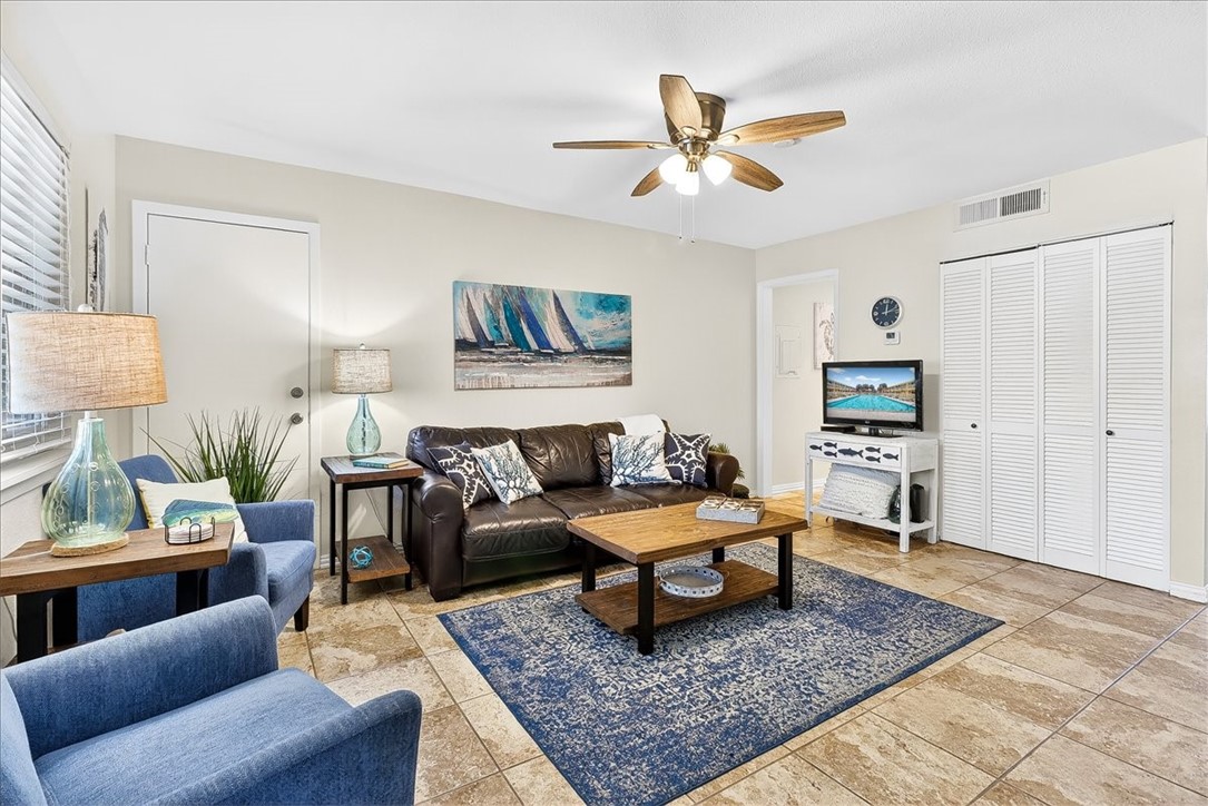 622 Beach Access Road, Unit 216 Port Aransas, TX 78373 - Photo 2 of 32 a living room with furniture and a rug