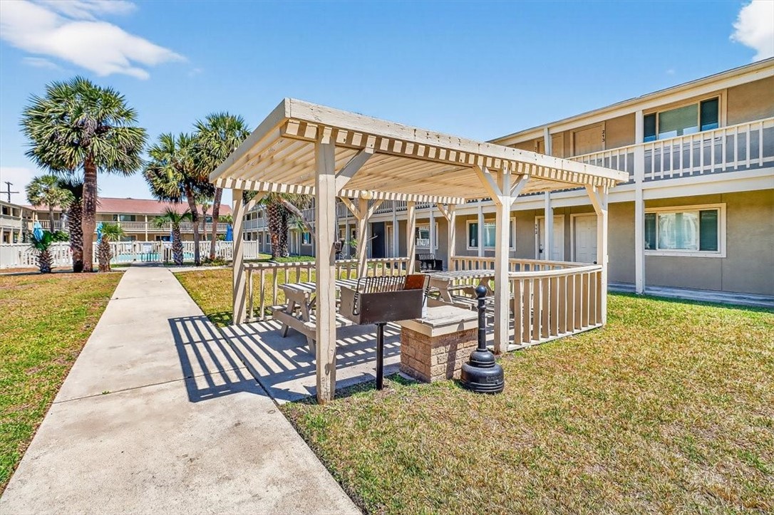 622 Beach Access Road, Unit 216 Port Aransas, TX 78373 - Photo 22 of 32 front view of a house with a patio
