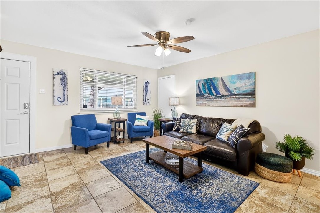 622 Beach Access Road, Unit 216 Port Aransas, TX 78373 - Photo 3 of 32 a living room with furniture and a rug