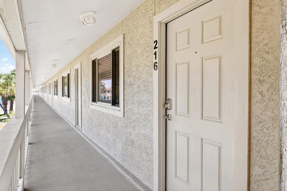 622 Beach Access Road, Unit 216 Port Aransas, TX 78373 - Photo 31 of 32 a view of an entryway with wooden floor