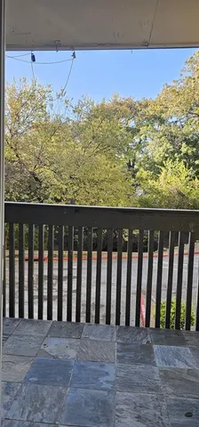 a view of a large pool with an outdoor space