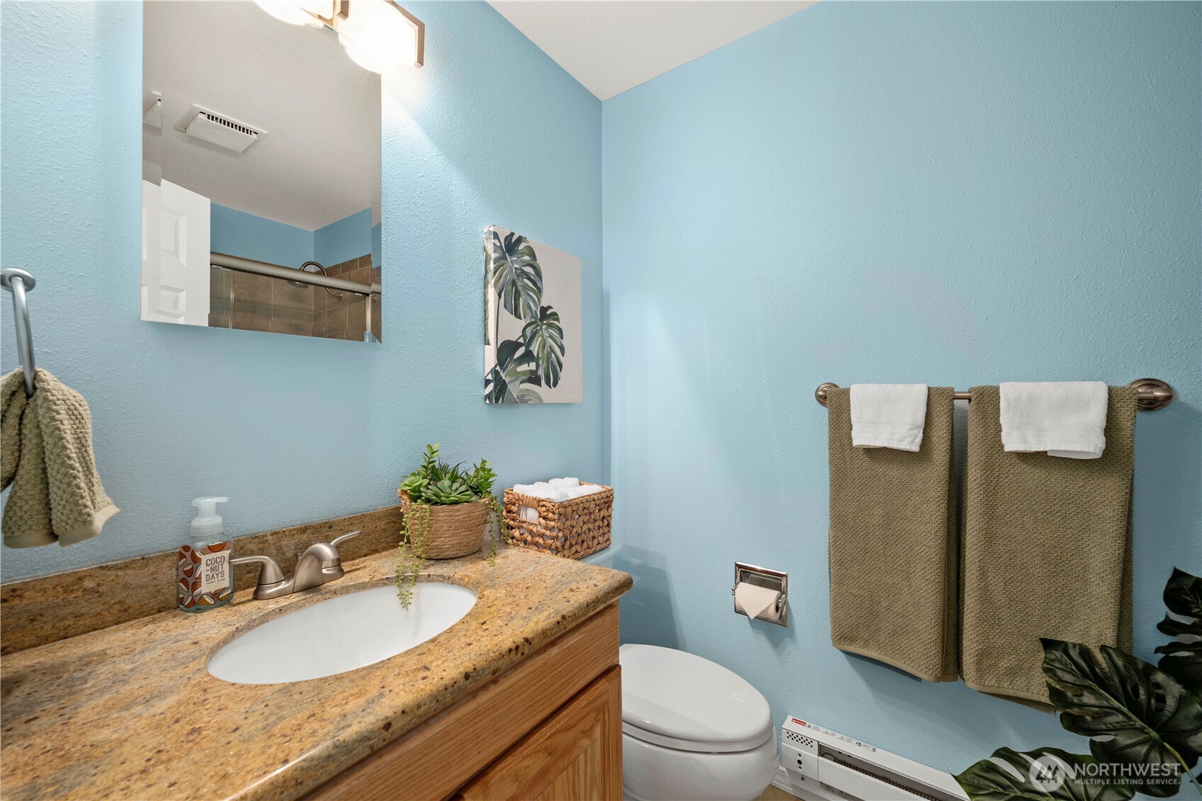13523 80th Street Southeast Snohomish, WA 98290 - Photo 6 of 12 a bathroom with a granite countertop sink and a mirror