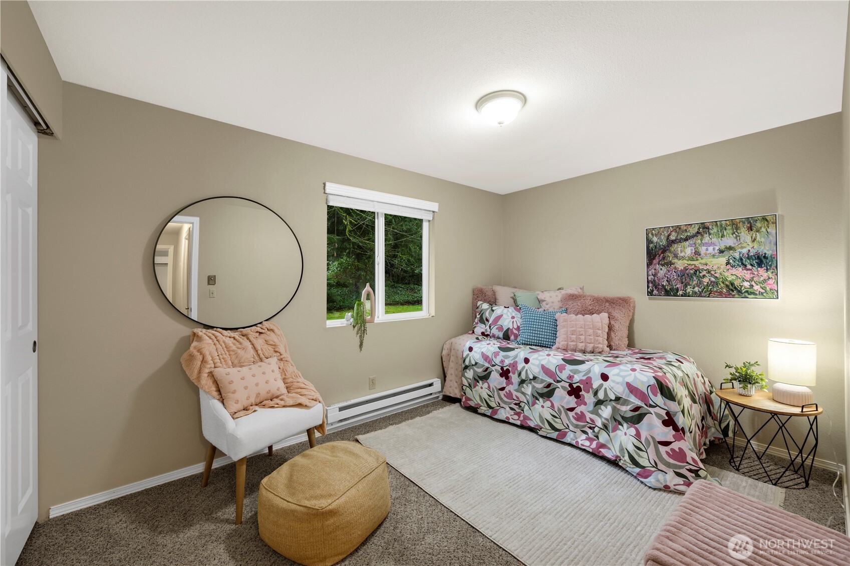 13523 80th Street Southeast Snohomish, WA 98290 - Photo 7 of 12 a bedroom with a bed a mirror and a large window