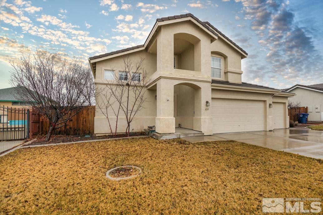 437 Rio Vista Drive Fallon, NV 89406 - Photo 1 of 24 a front view of a house with parking area
