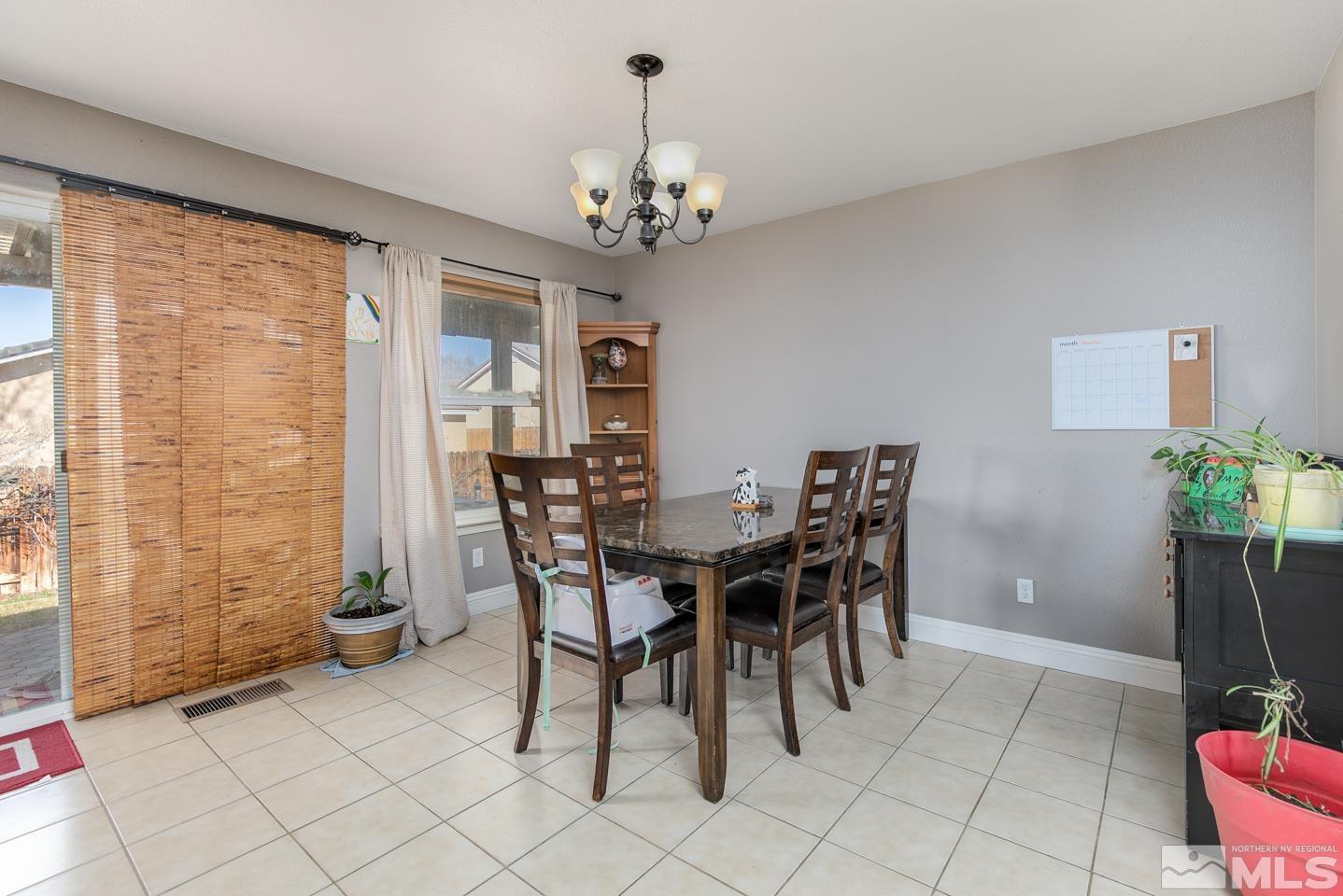 437 Rio Vista Drive Fallon, NV 89406 - Photo 7 of 24 a view of a dining room with furniture and a chandelier