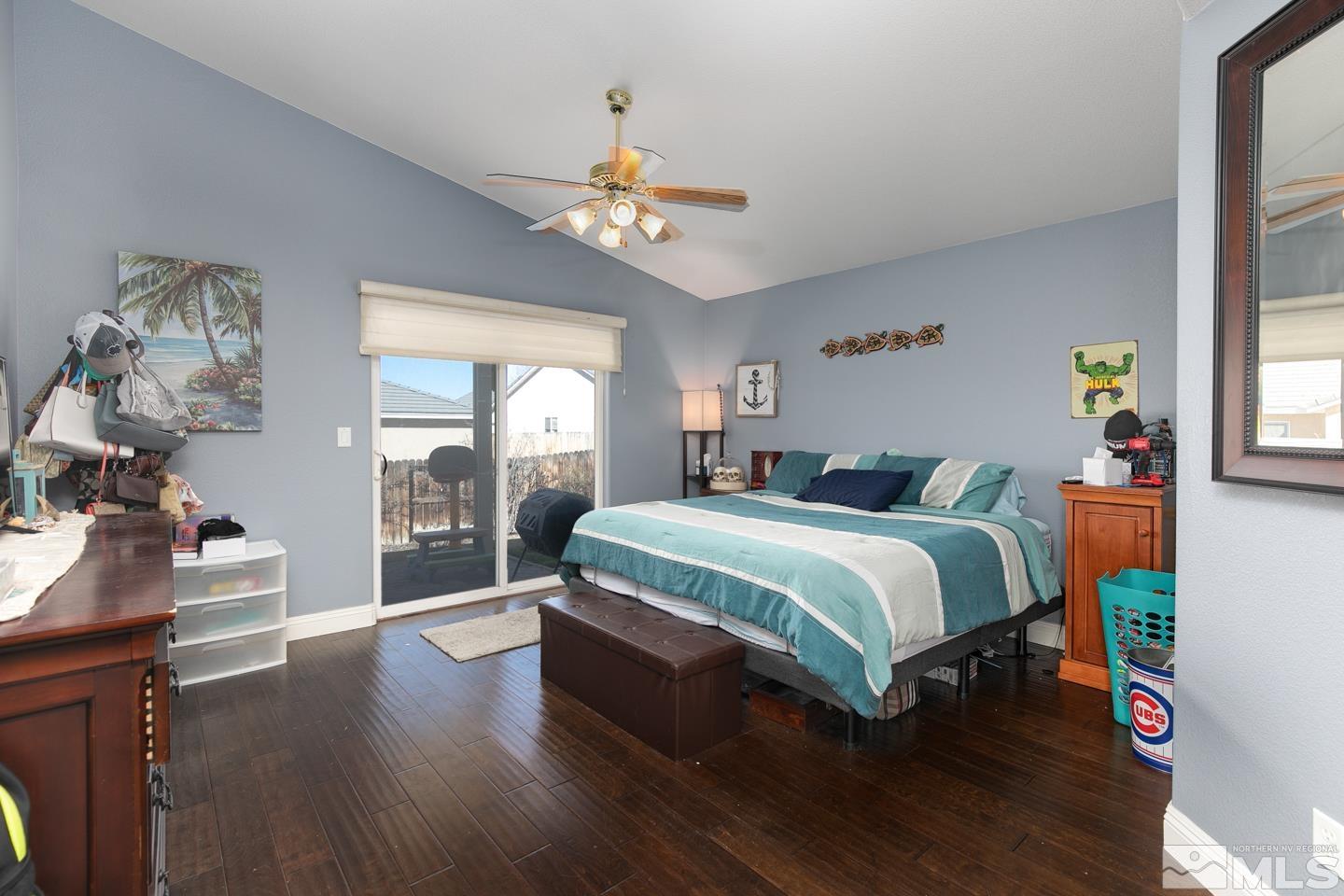 437 Rio Vista Drive Fallon, NV 89406 - Photo 9 of 24 a spacious bedroom with a bed and dresser with wooden floor