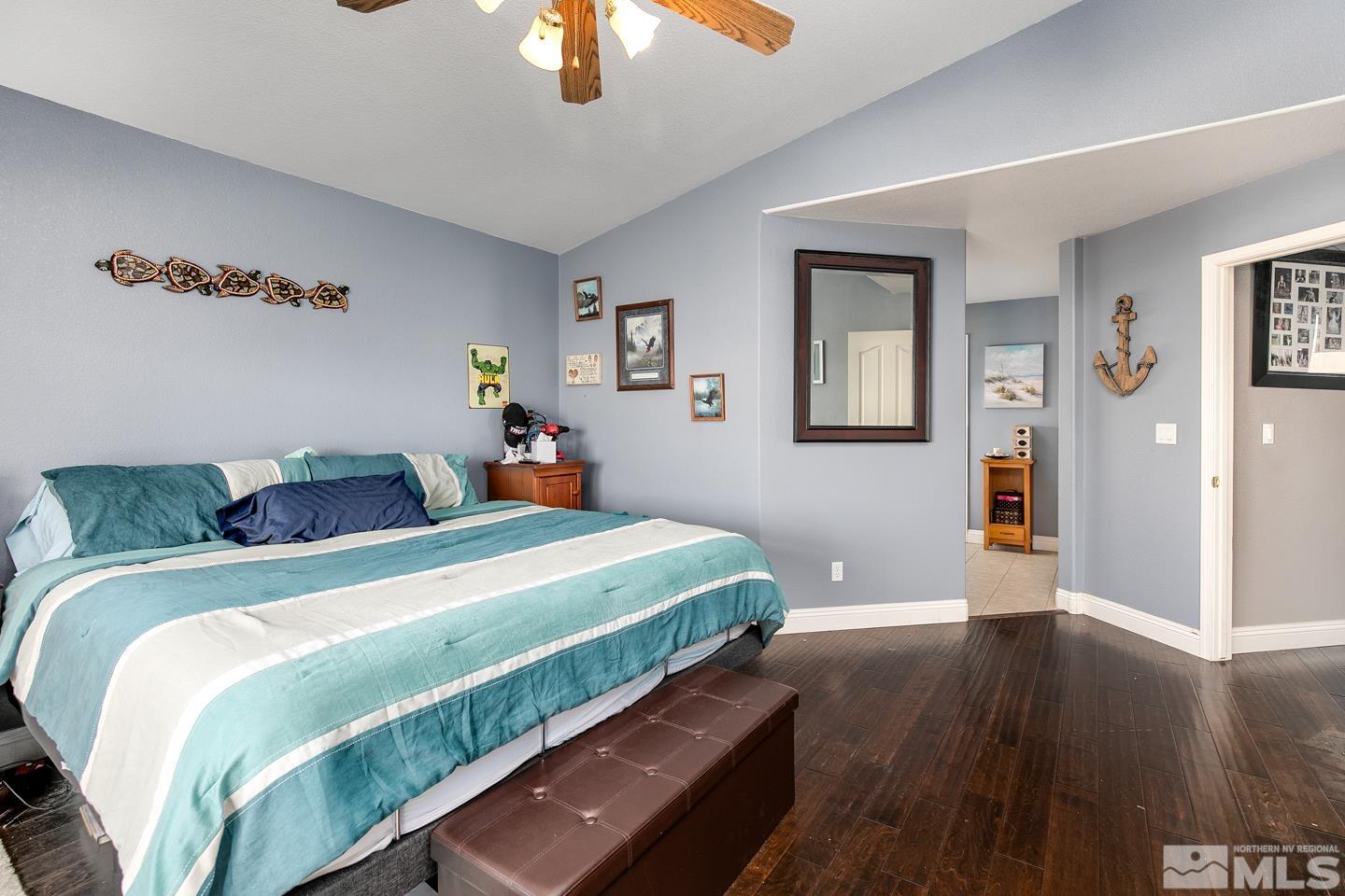 437 Rio Vista Drive Fallon, NV 89406 - Photo 10 of 24 a bedroom with a bed and wooden floor