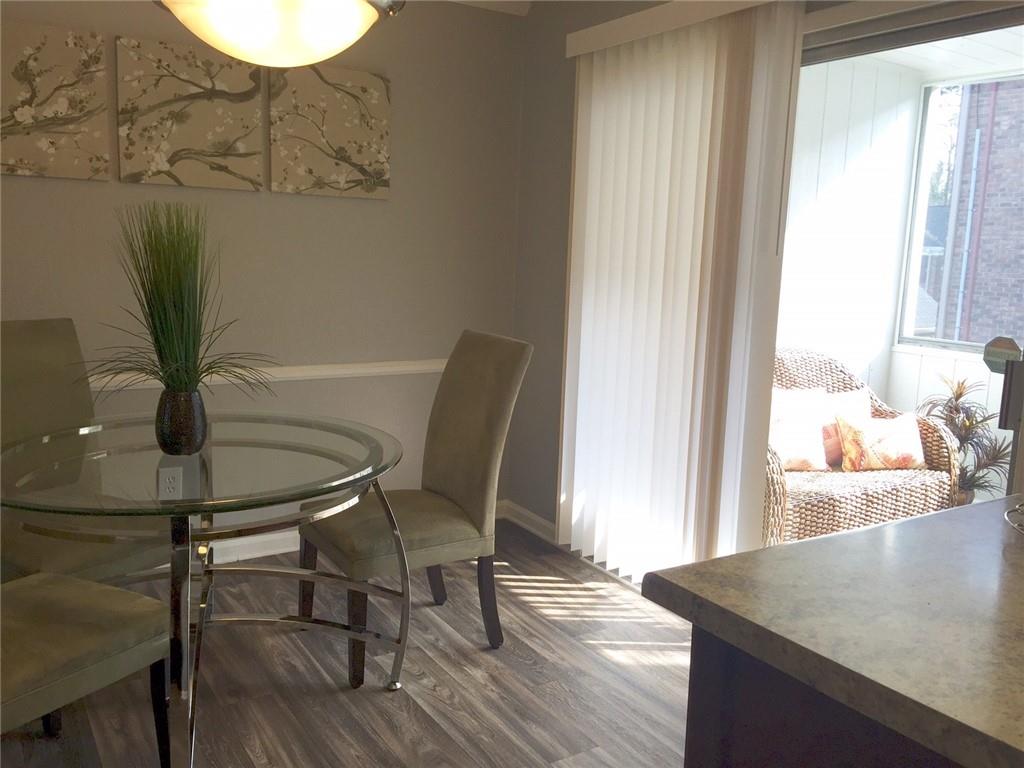 4883 Roswell Road, Unit N1 Atlanta, GA 30342 - Photo 4 of 15 a view of a dining room with furniture and wooden floor