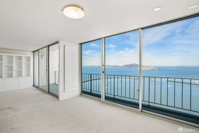 a kitchen with stainless steel appliances a stove microwave and sink