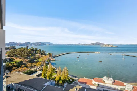 an aerial view of a house with a ocean view