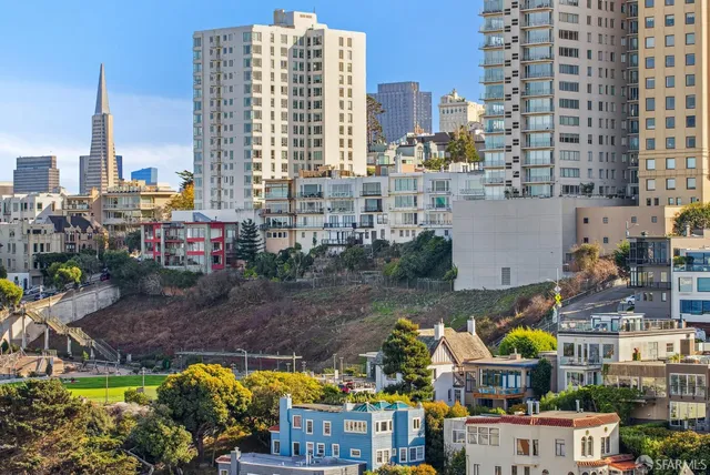 a bathroom with a shower sink and mirror