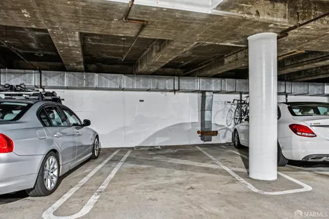 a living room with furniture and large windows
