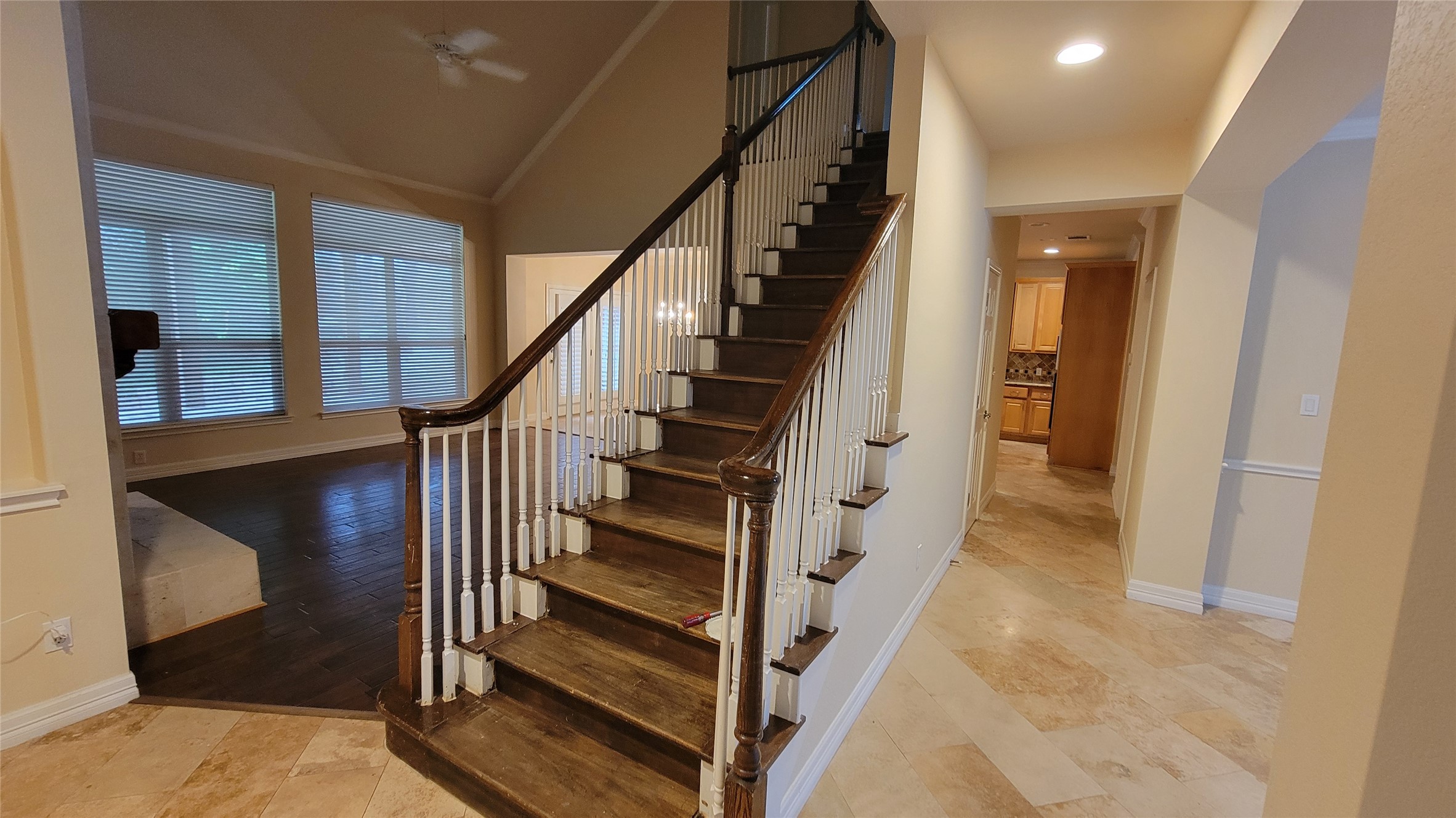 2832 Grimes Ranch Road Austin, TX 78732 - Photo 7 of 37 Grand staircase entry unfolds into sun-filled living areas, creating an inviting flow.