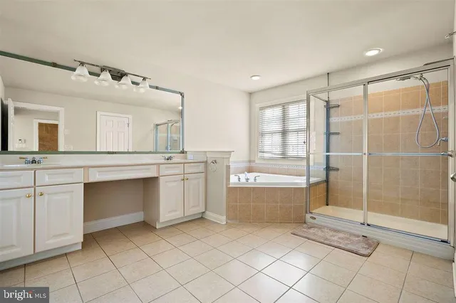 a bathroom with a sink a mirror and a bathtub
