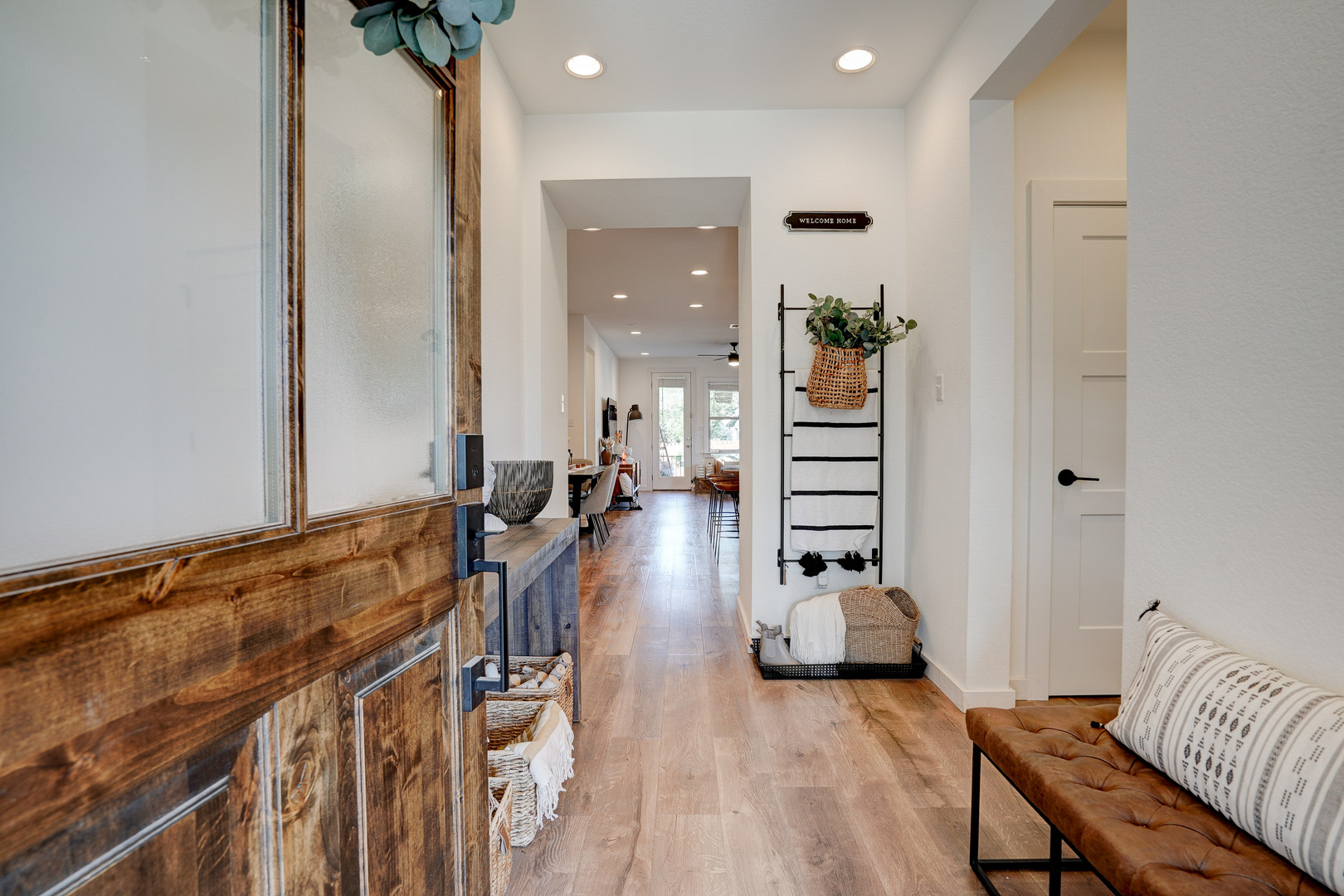 2240 Ringstaff Road Leander, TX 78641 - Photo 4 of 25 Wood-finish flooring extending through a bright entryway