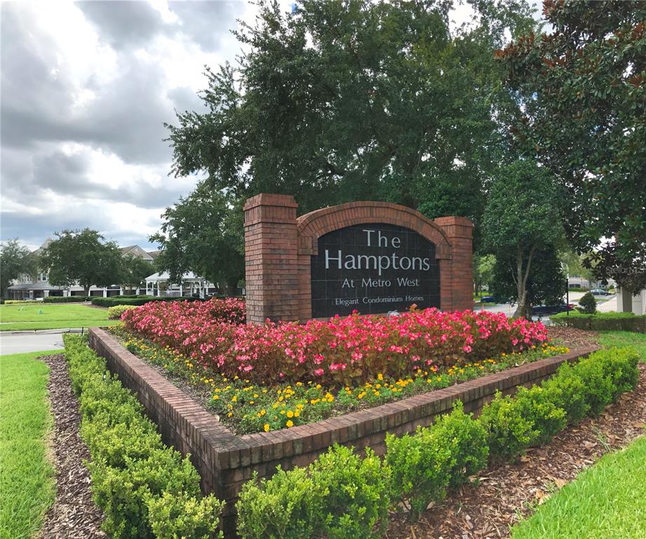 3280 Soho Street, Unit 307 Orlando, FL 32835 - Photo 3 of 34 a sign on the side of the road