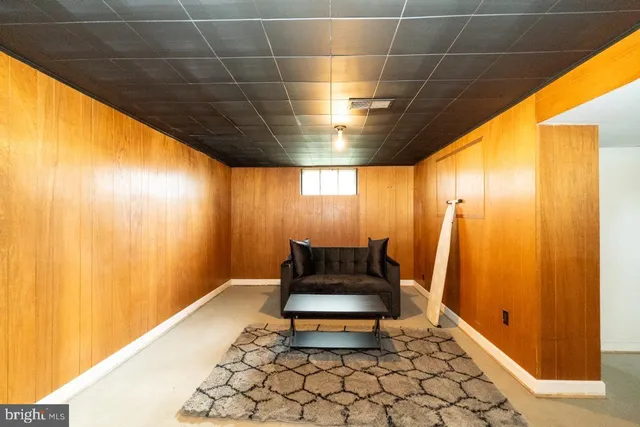 a bedroom with a bed and a night stand