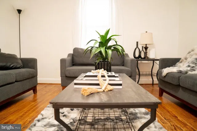 a bedroom with a bed and a night stand