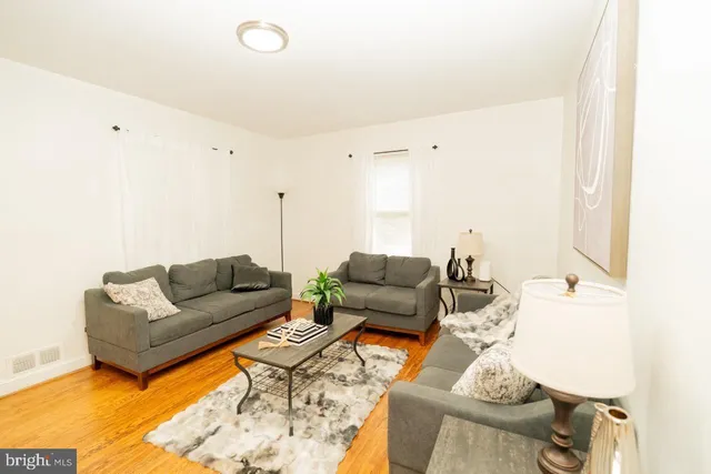 a view of a living room and entryway