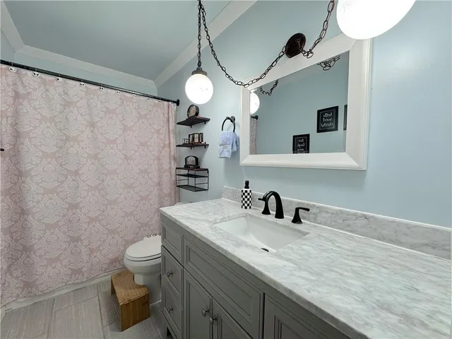 a view of a room with furniture and window