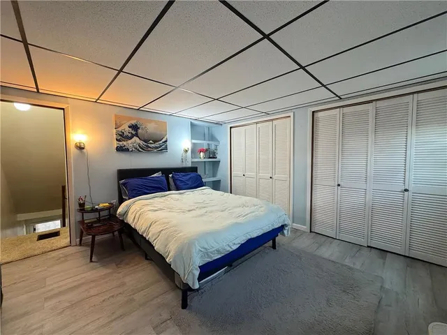 a bedroom with a bed and a closet