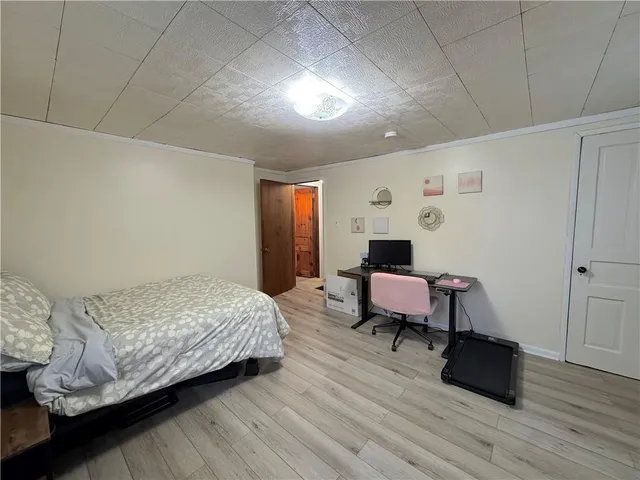 a bedroom with a bed and a table