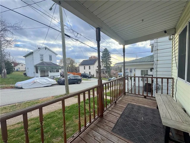 a view of balcony with furniture
