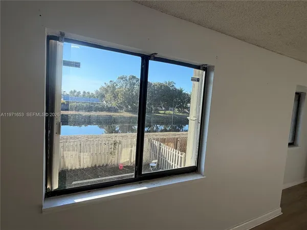 a view of front door and deck of the house