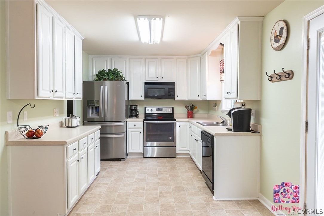 2936 Lowry Road Columbia, VA 23038 - Photo 6 of 11 a kitchen with stainless steel appliances a stove refrigerator sink and dishwasher