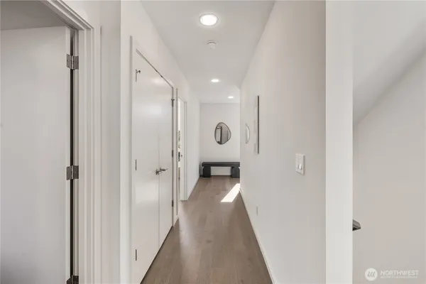 a view of a hallway with a white walls