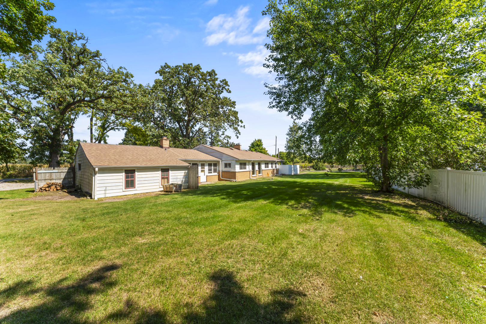 4501 East Kuhn Road Richmond, IL 60071 - Photo 3 of 3 a front view of a house with yard and green space