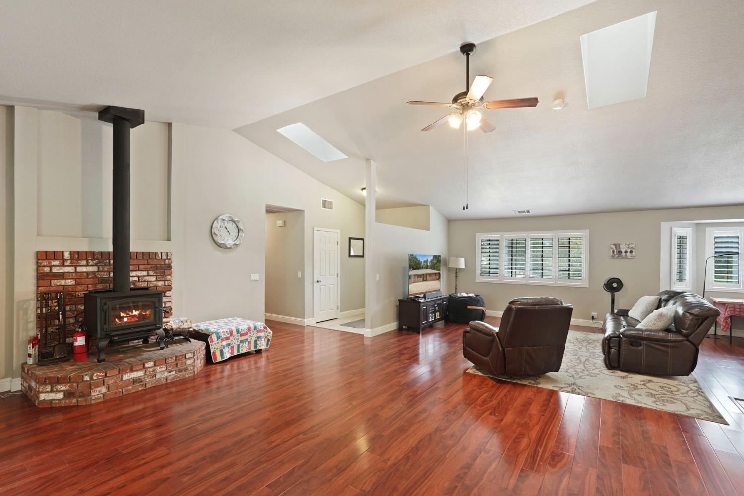 3234 Cambridge Road Cameron Park, CA 95682 - Photo 24 of 42 a living room with furniture and wooden floor