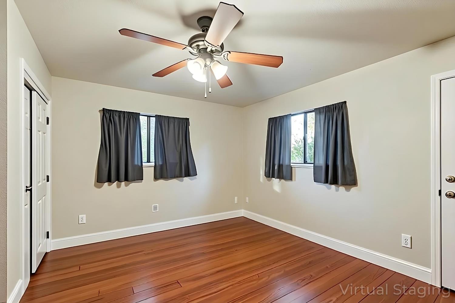 3234 Cambridge Road Cameron Park, CA 95682 - Photo 31 of 42 a view of an empty room with wooden floor and a ceiling fan