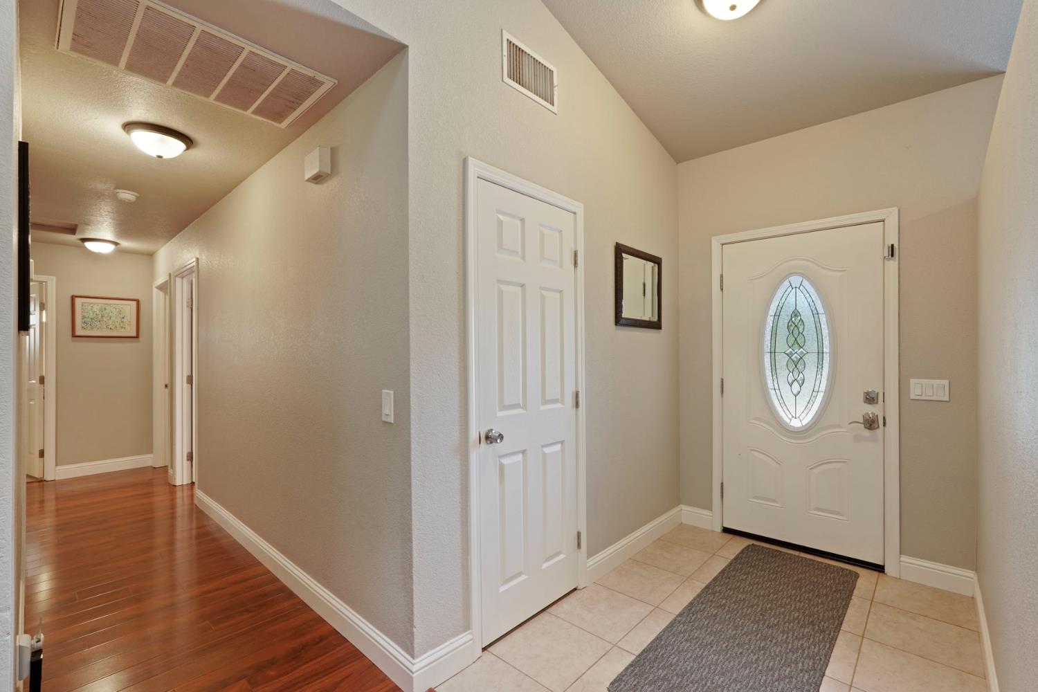 3234 Cambridge Road Cameron Park, CA 95682 - Photo 5 of 42 a view of an entryway with wooden floor