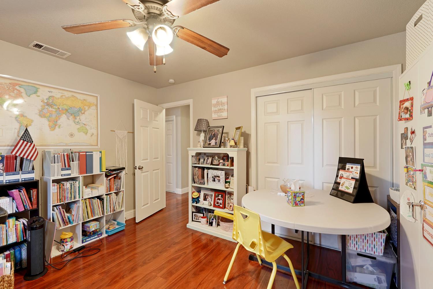 3234 Cambridge Road Cameron Park, CA 95682 - Photo 9 of 42 a view of a workspace with furniture and a bookshelf