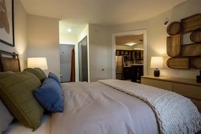 a bed room with a bed and night stand