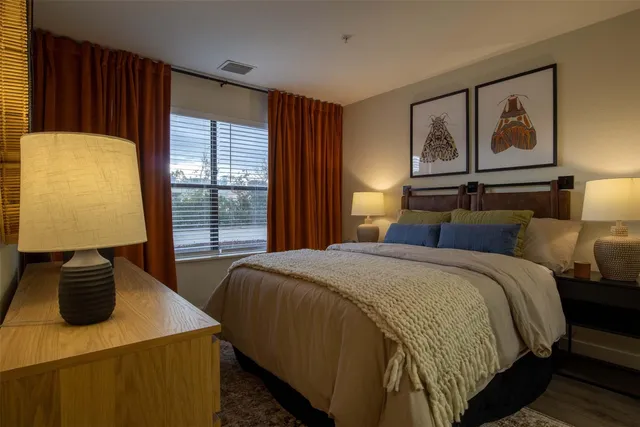 a bedroom with a bed and window