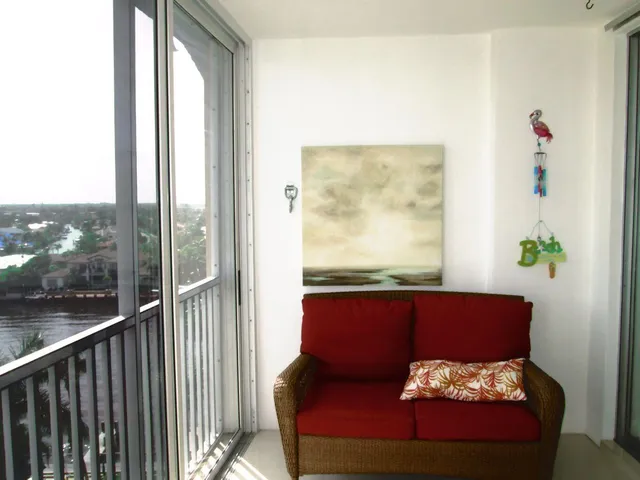 a view of a balcony with furniture