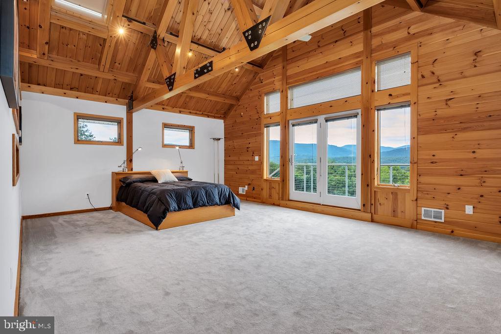 218 Thunder Road Front Royal, VA 22630 - Photo 34 of 78 Upper level owners suite w/ soaring pine ceilings