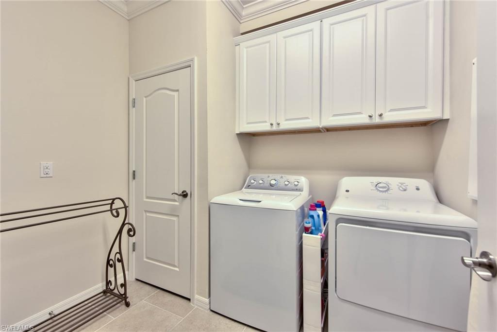 6922 Avalon Circle, Unit 206 Naples, FL 34112 - Photo 21 of 32 a utility room with dryer and washer