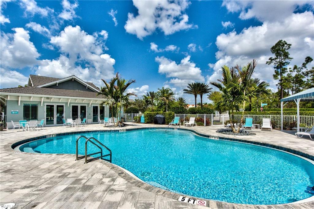 6922 Avalon Circle, Unit 206 Naples, FL 34112 - Photo 26 of 32 a view of a house with swimming pool