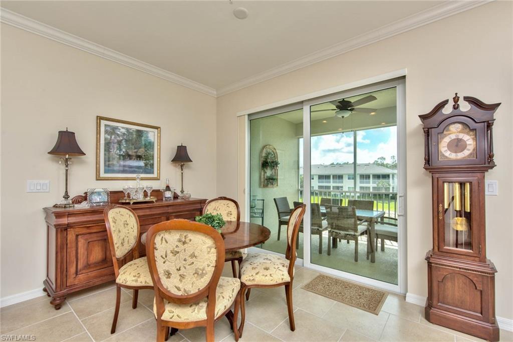 6922 Avalon Circle, Unit 206 Naples, FL 34112 - Photo 6 of 32 a view of a livingroom with furniture wooden floor and a rug