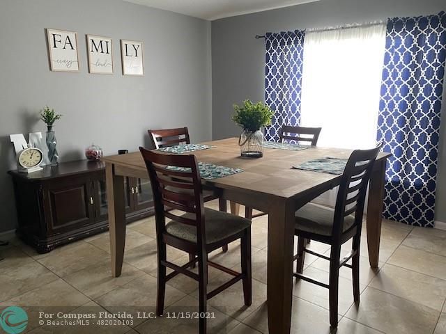 2147 Marisol Loop Kissimmee, FL 34743 - Photo 7 of 20 a view of a dining room with furniture