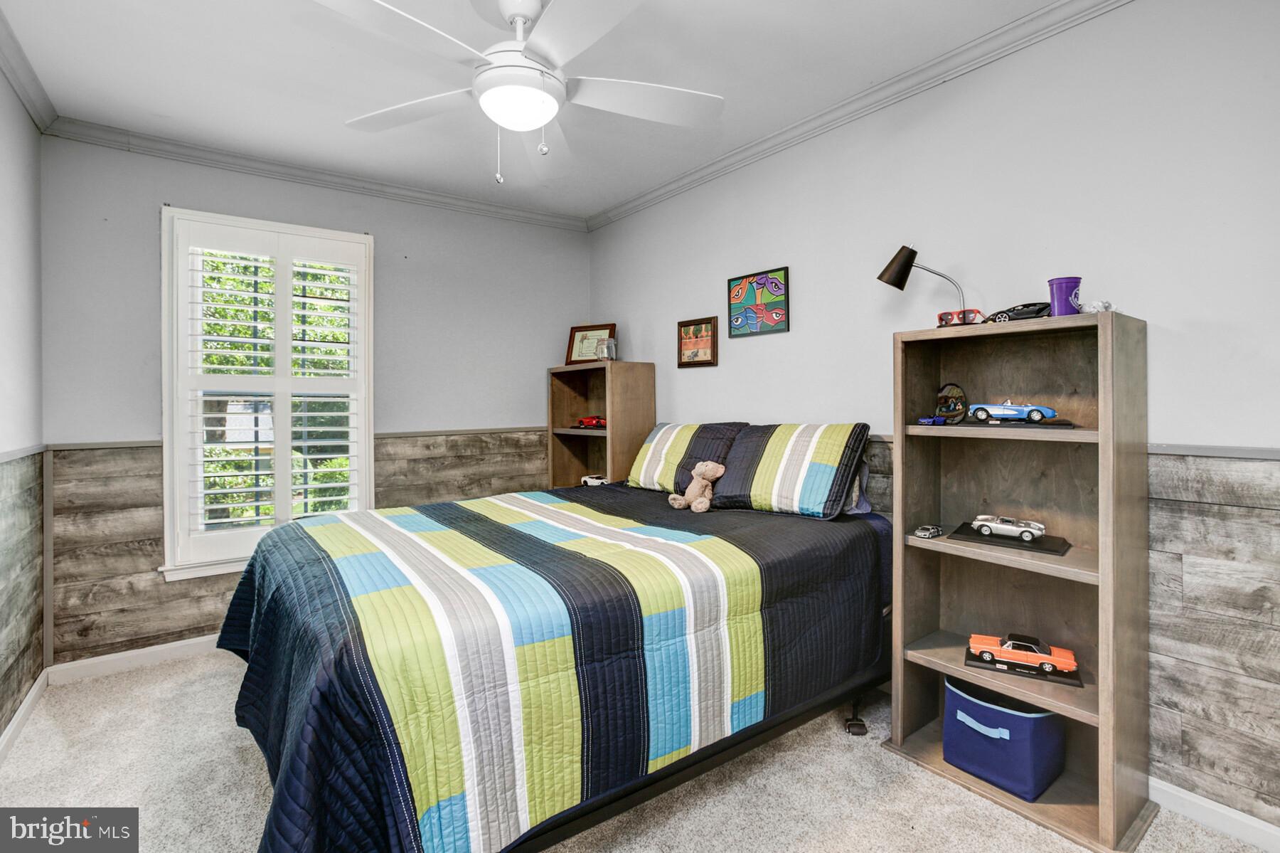 307 Saddle Ridge Road Annapolis, MD 21403 - Photo 30 of 46 a bedroom with a bed and a window