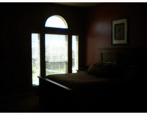 a front view of a house with a large window