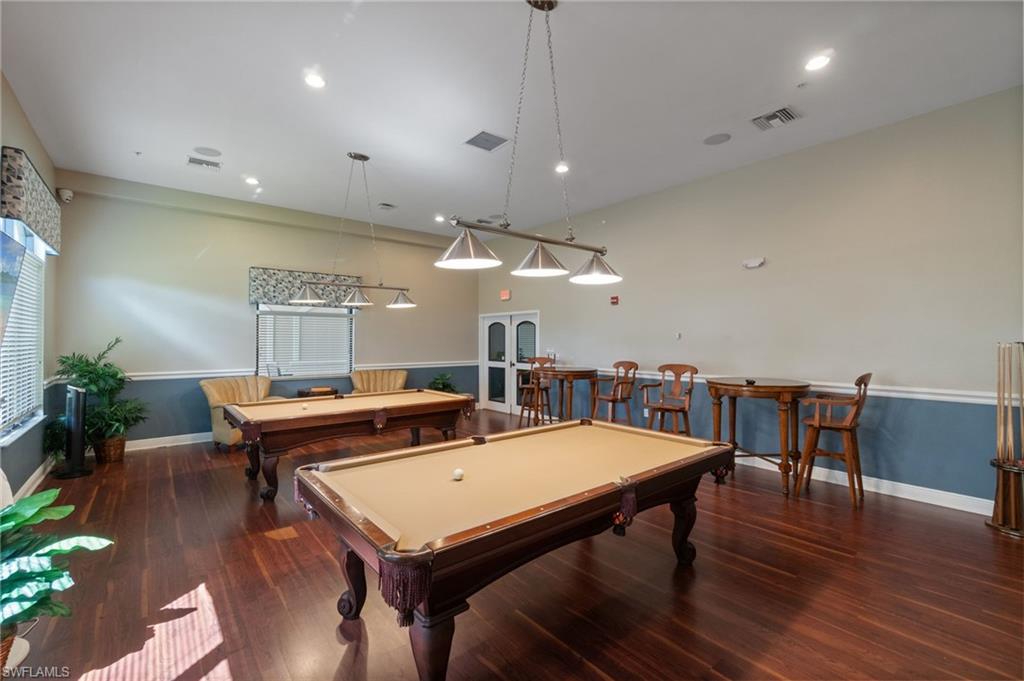 19753 Tesoro Way Estero, FL 33967 - Photo 41 of 47 a view of a dining room with furniture and wooden floor